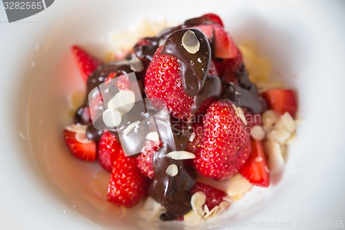 Image of fresh strawberries dipped in dark chocolate