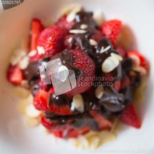 Image of fresh strawberries dipped in dark chocolate