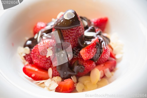 Image of fresh strawberries dipped in dark chocolate