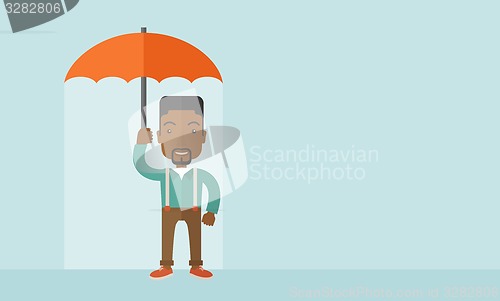 Image of Successful man with umbrella.