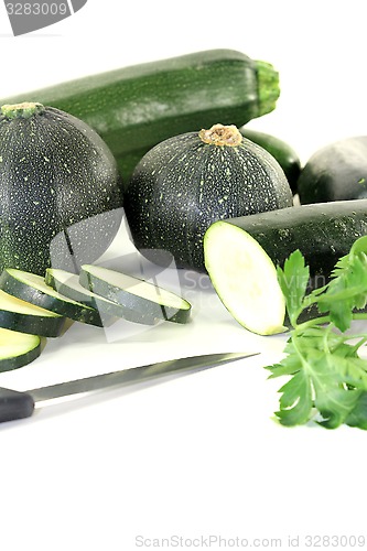 Image of zucchini mixed with parsley and knife