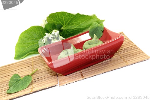 Image of fresh Wasabi with leaf and blossom