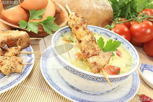 Image of Asian Chicken soup with tomatoes