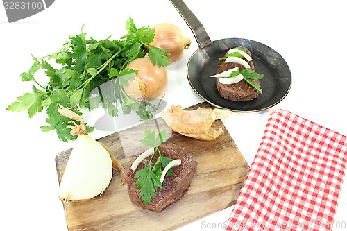 Image of Ostrich steak with parsley