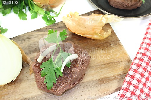 Image of Ostrich steaks with sharp onions