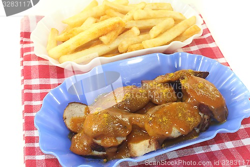 Image of Currywurst with french fries