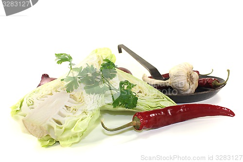 Image of sweetheart cabbage with parsley in a pan