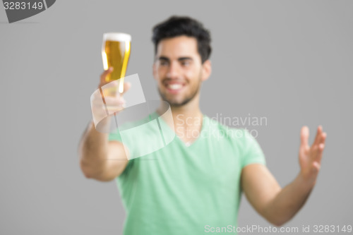 Image of Young man drinking beer