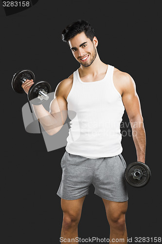 Image of Athletic man lifting weights