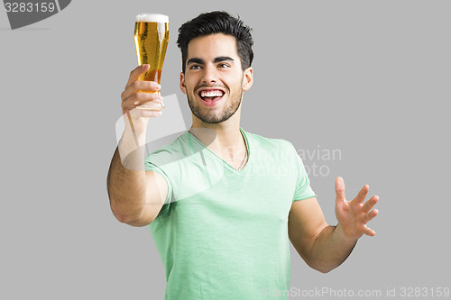 Image of Young man drinking beer