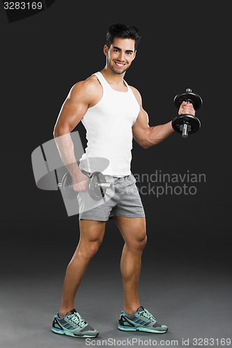 Image of Athletic man lifting weights