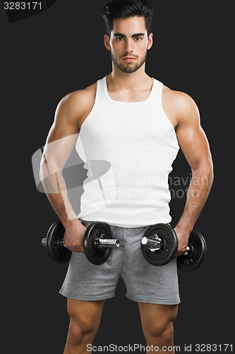 Image of Athletic man lifting weights