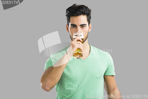 Image of Young man drinking beer