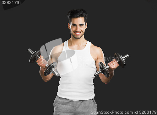 Image of Athletic man lifting weights