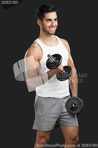 Image of Athletic man lifting weights