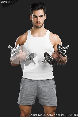 Image of Athletic man lifting weights