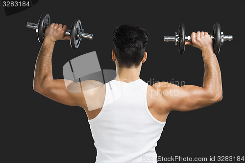 Image of Athletic man lifting weights