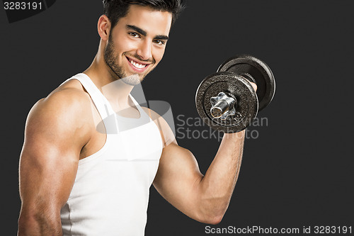 Image of Athletic man lifting weights