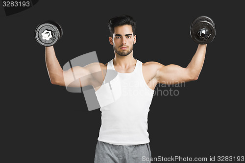 Image of Athletic man lifting weights