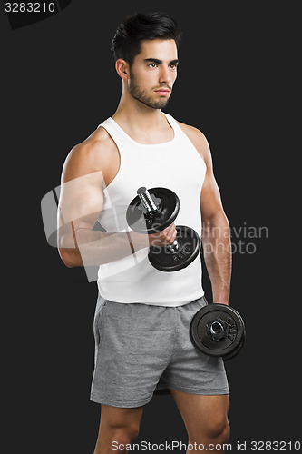 Image of Athletic man lifting weights