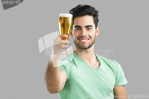 Image of Young man drinking beer