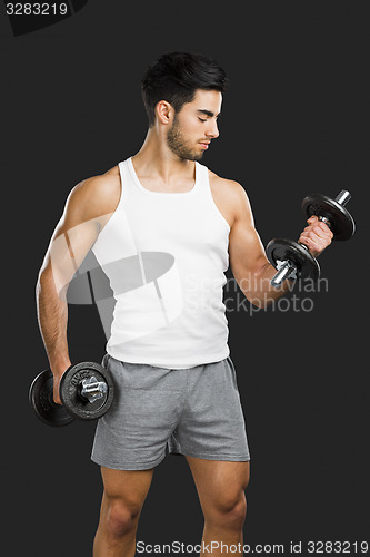 Image of Athletic man lifting weights