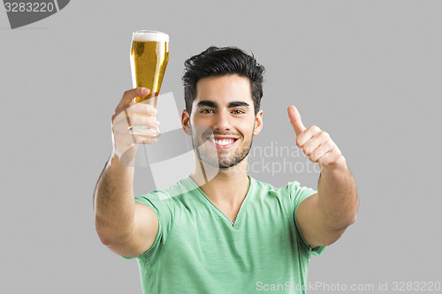 Image of Young man drinking beer