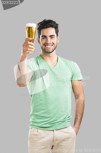 Image of Young man drinking beer