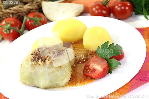 Image of Stuffed cabbage with potatoes and gravy