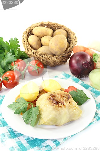 Image of Stuffed cabbage with potatoes and tomato