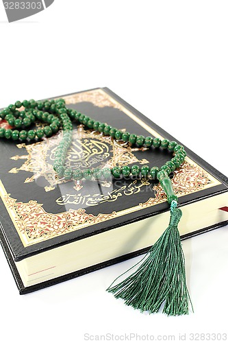 Image of Quran with rosary