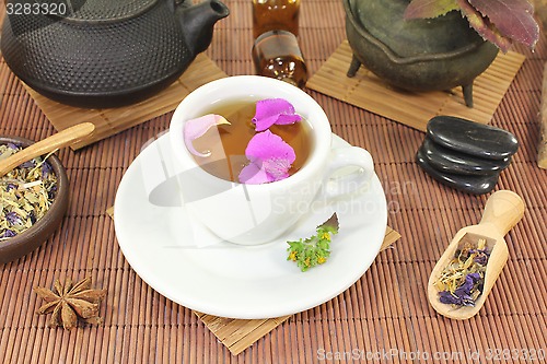 Image of Chinese natural medicine with a cup of tea