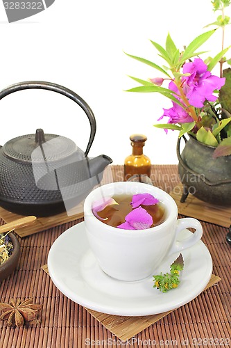 Image of Chinese natural medicine with a cup of tea and anise