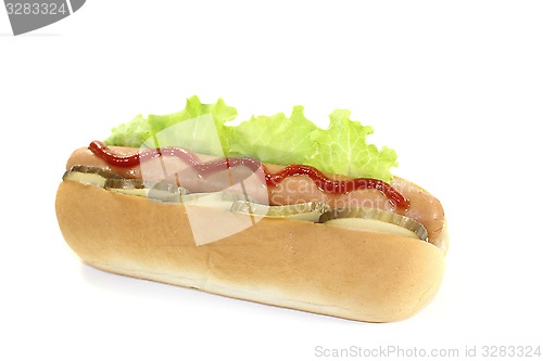 Image of Hot dog with pickle and ketchup