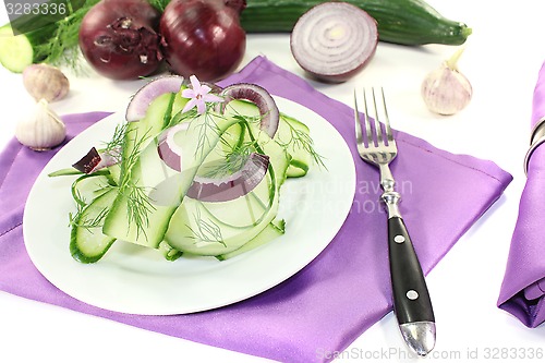 Image of Cucumber salad with dill and garlic flower