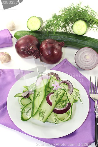 Image of Cucumber salad with onions and garlic flower