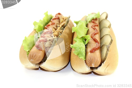 Image of Hot dogs with pickle and fried onions