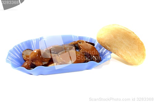 Image of Currywurst with roll