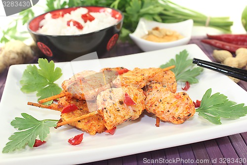Image of Asian satay skewers with chilli and peanut sauce