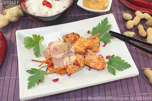 Image of Asian satay skewers with chilli and rice