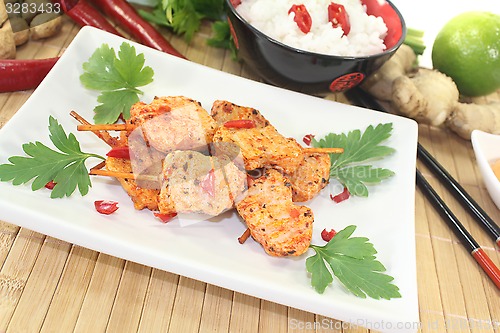 Image of Asian satay skewers with chilli and parsley