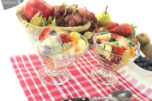 Image of Fruit salad in a bowl on checkered napkin