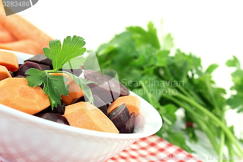 Image of crisp orange and purple carrots