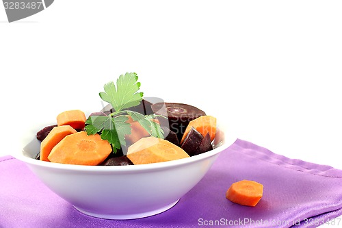 Image of sliced orange and purple carrots