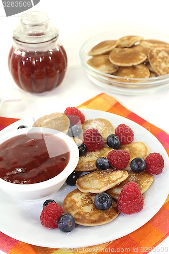 Image of Poffertjes with berries and jelly