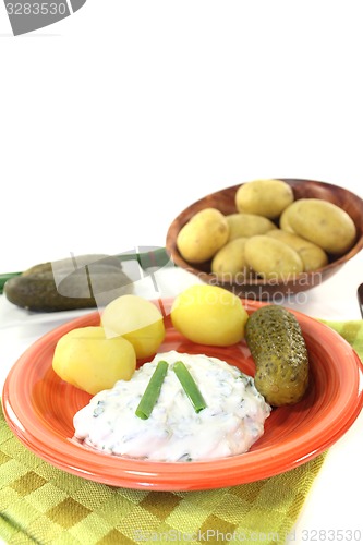 Image of Potatoes with curd, pickles and chives