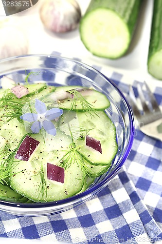 Image of Cucumber salad with onions and borage flower