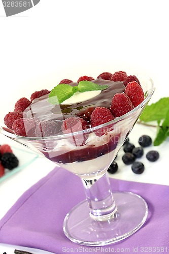 Image of Layered dessert with blueberries and raspberries