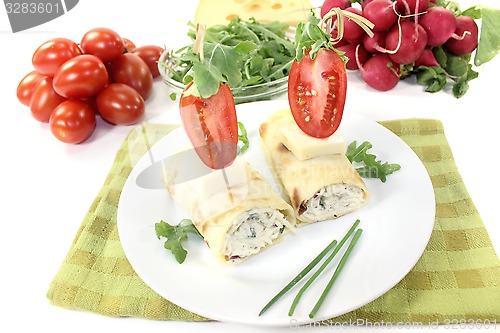 Image of stuffed cheese crepe rolls