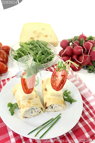 Image of stuffed cheese crepe rolls with chives